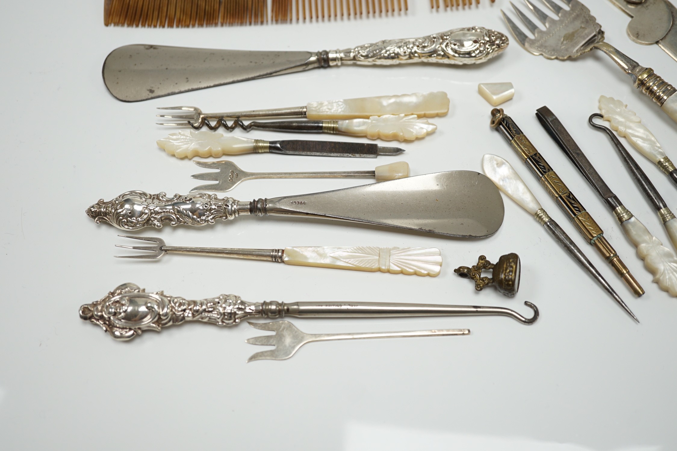 A group of assorted small silver and white metal items, including a small late Victorian clover shaped nut dish, napkin rings, pill box, etc and other items including two gilt metal mounted chalcedony fob seals.